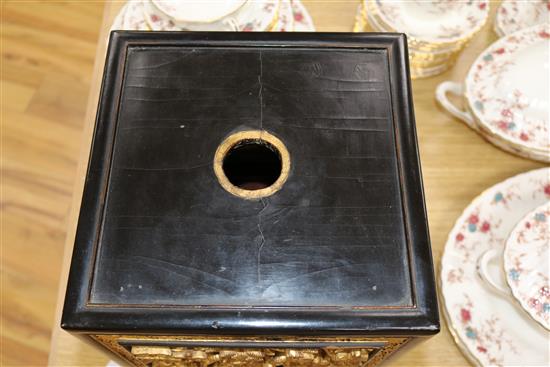 A late 19th/early 20th century Chinese giltwood and black lacquer incense stand